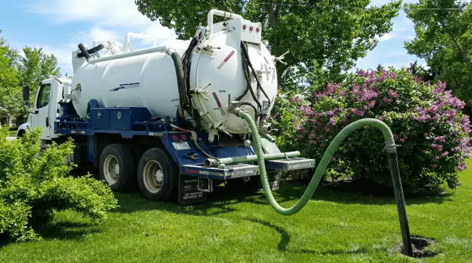 Professional vacuum truck performing residential drainage and septic maintenance in Ann Arbor, MI